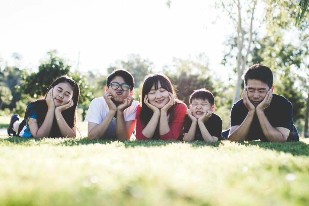 Family with children meditation in nature